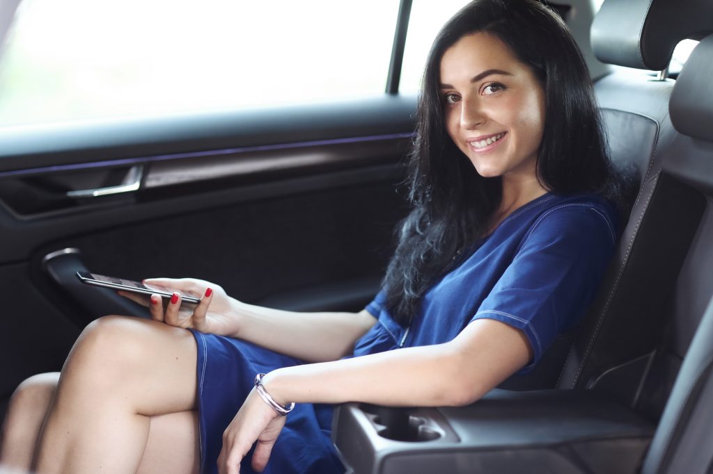 Woman in a car as passenger